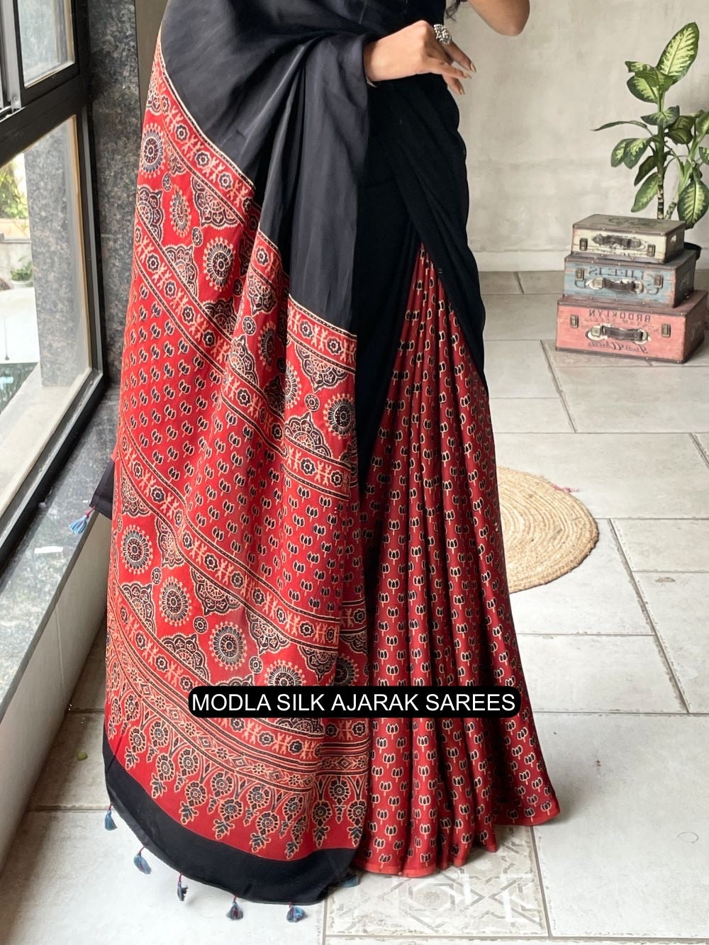 Ajrakh Printed Saree Black & Red Modal Silk with Heritage Border, Traditional Pallu & Tassel Detailing