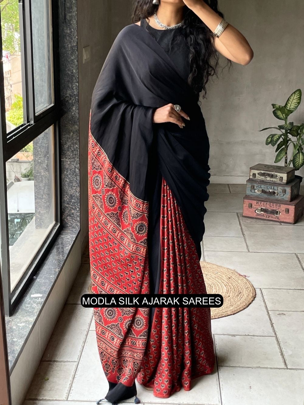 Ajrakh Printed Saree Black & Red Modal Silk with Heritage Border, Traditional Pallu & Tassel Detailing