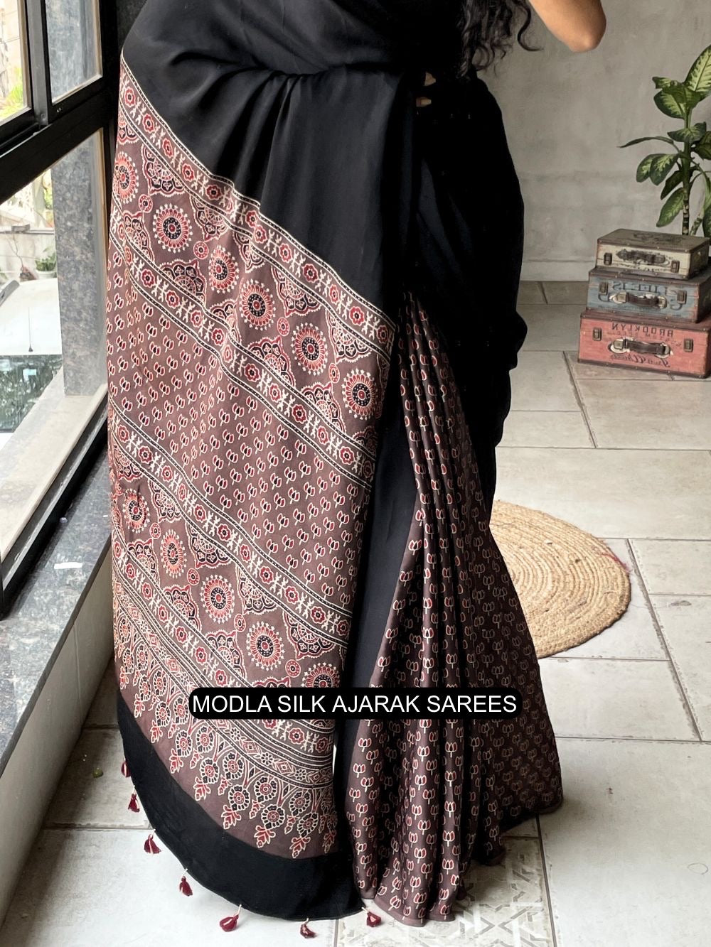 Ajrakh Printed Saree Black Modal Silk with Traditional Heritage Pallu, Intricate Ethnic Motifs & Tassel Detailing