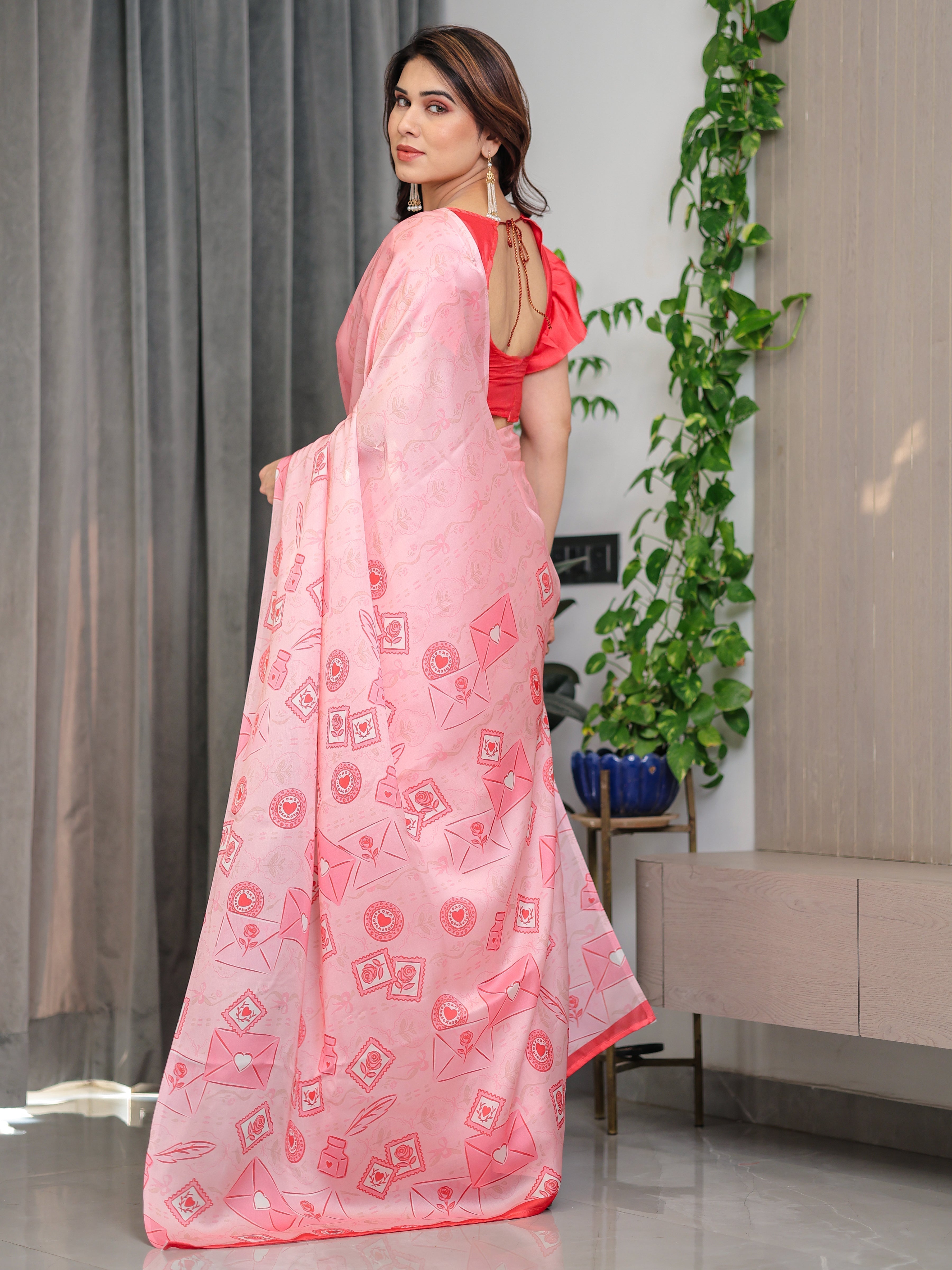 Soft Baby Pink Satin Georgette Saree with Love Letter & Stamp Motif Print and Attached Coral Red Plain Blouse – 5.5 Meter Romantic Designer Saree for Valentine’s Day & Anniversary Wear