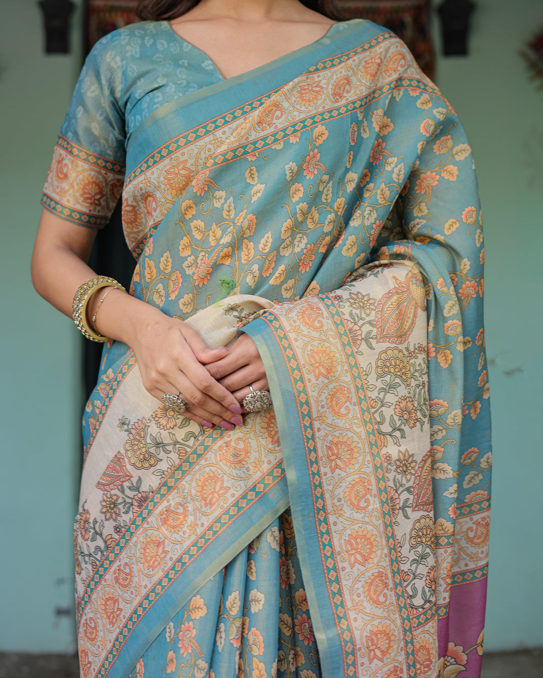 Turquoise Blue Handloom Cotton Saree with Multicolor Floral Pallu & Peach Border