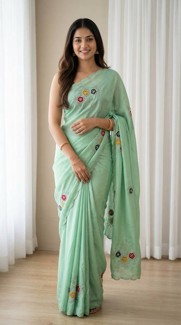Graceful Mint Green Soft Rangoli Saree with Handwork Floral Butta
