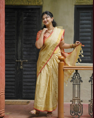 Elegant Beige Soft Tissue Saree with Red Border & Matching Blouse Piece